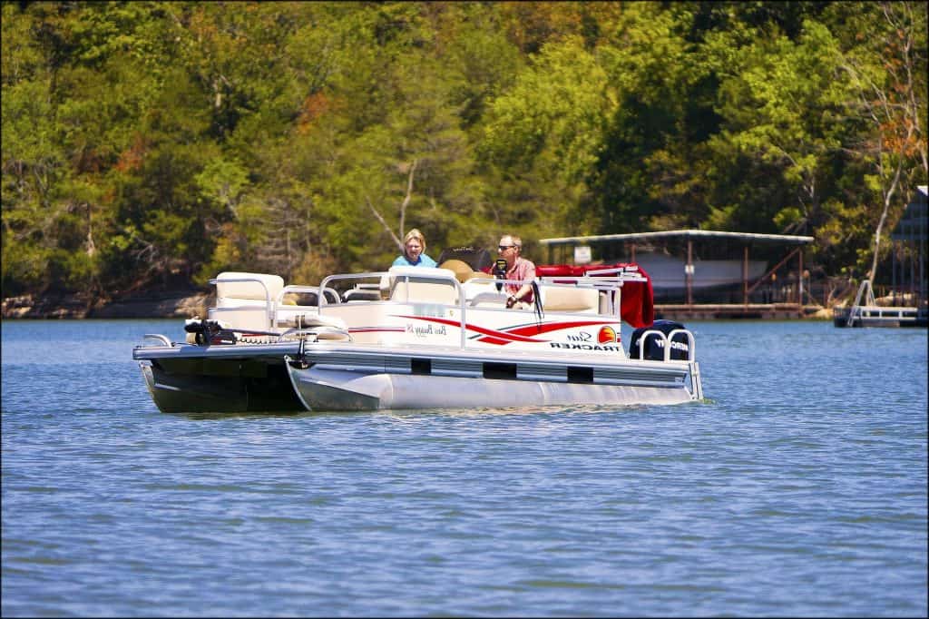 pontoon party boat on a lake