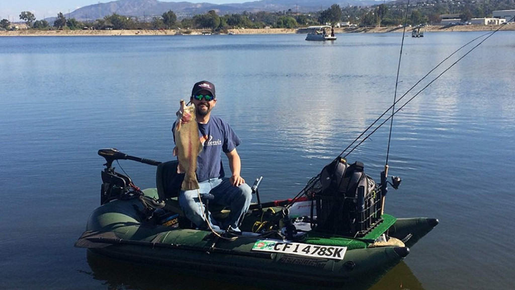 fisherman using the best inflatable pontoon boat for fishing