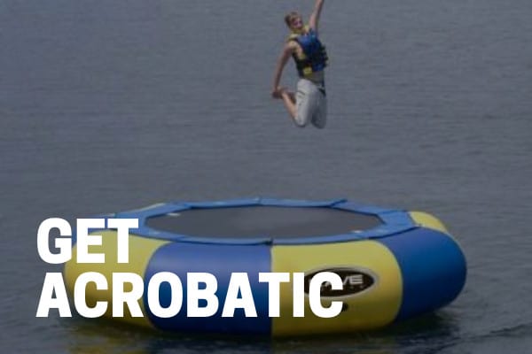 kid using best water trampoline and floating bouncer on a lake